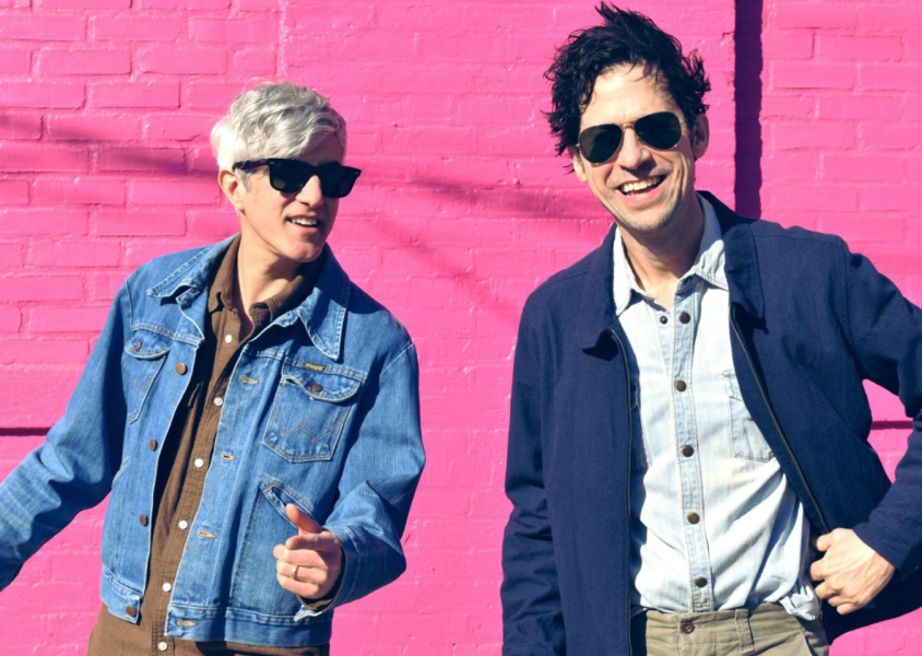 Band We Are Scientists press shot - smiling infront of pink wallx